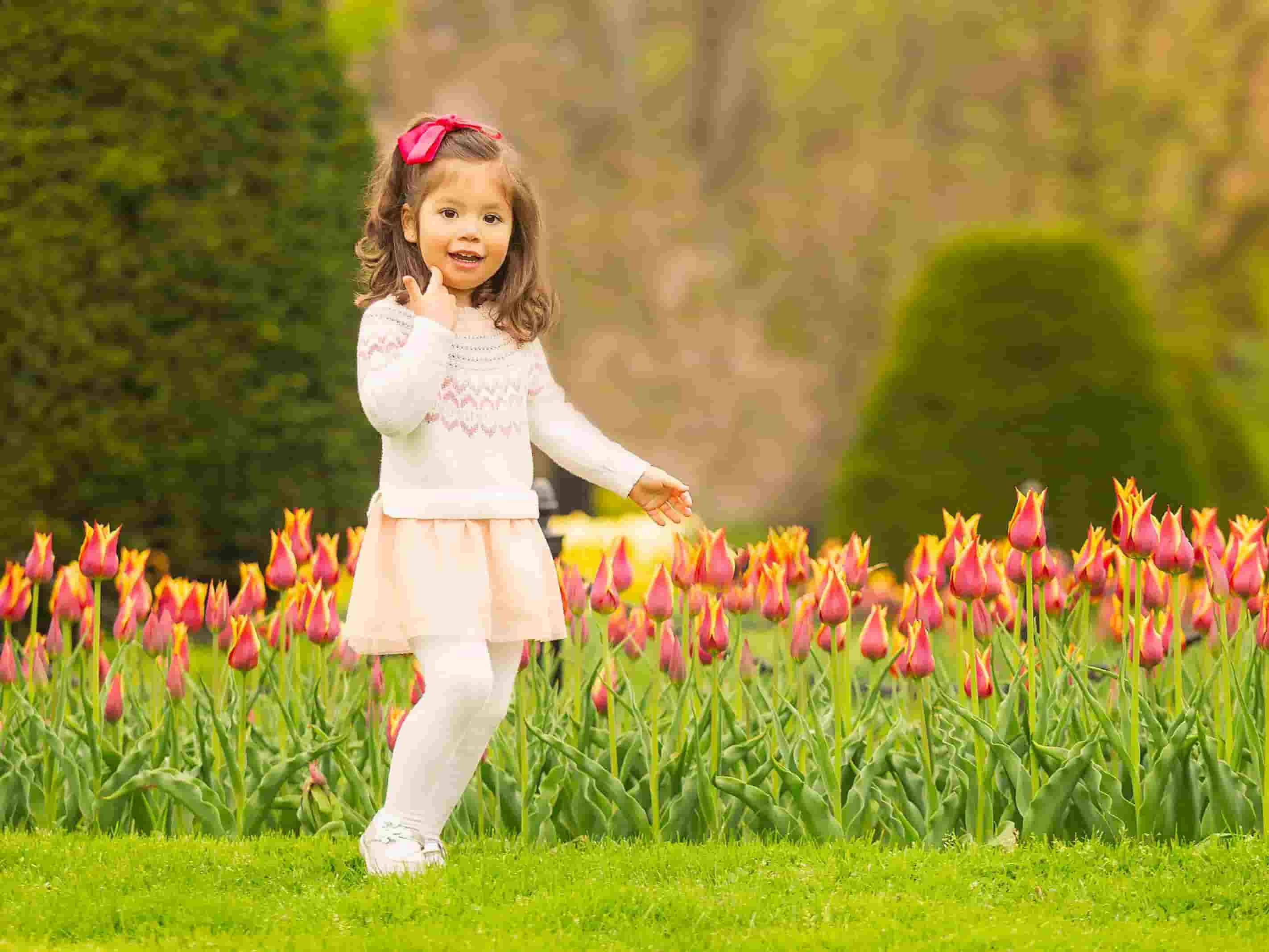 little girl enjoying the garden