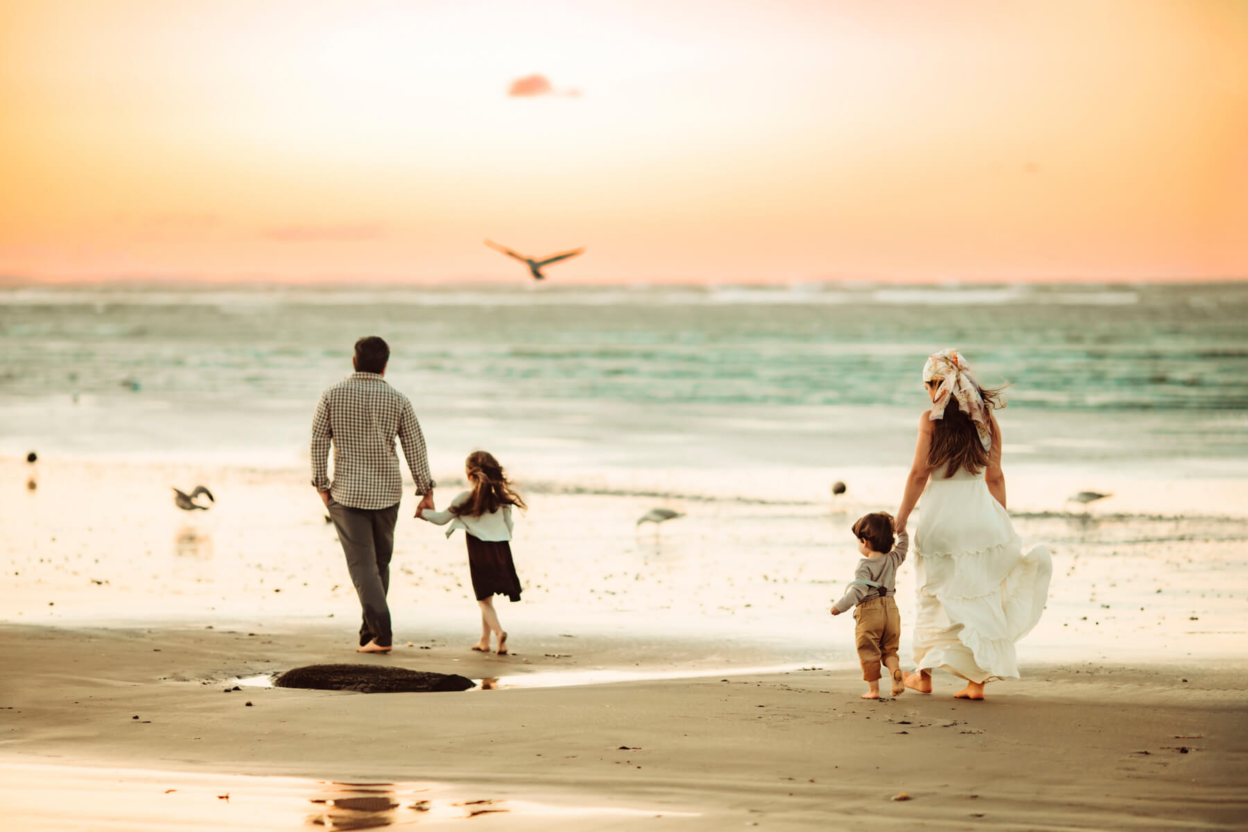 Beach family photo during a sunset in Gloucester, MA