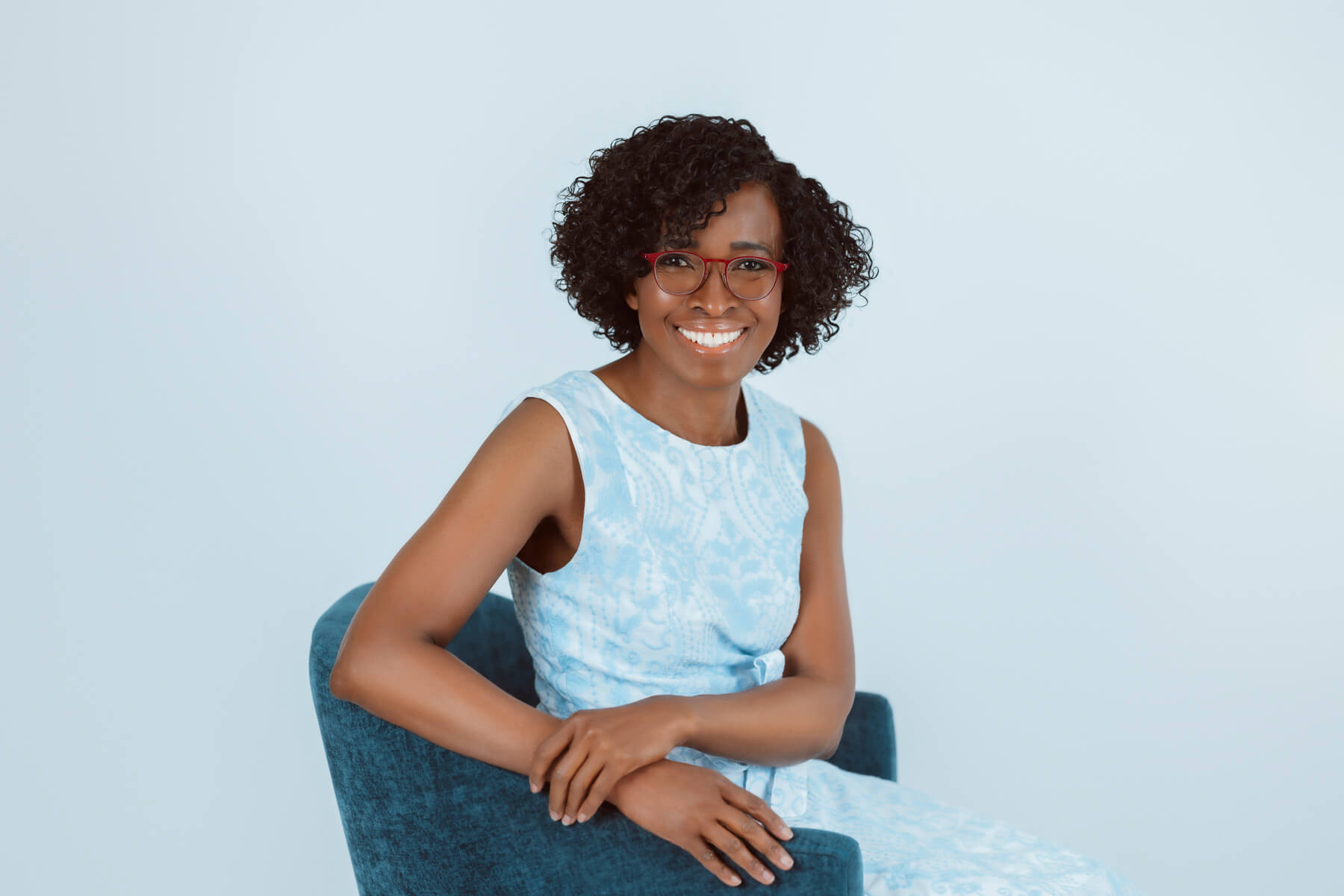 Woman with curls and glasses Headshot at studio, in Lexington, Massachusetts
