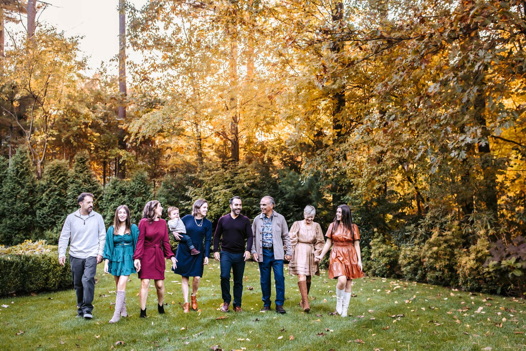 Extended Family walking on a green garden, at Lexington, Massachusetts