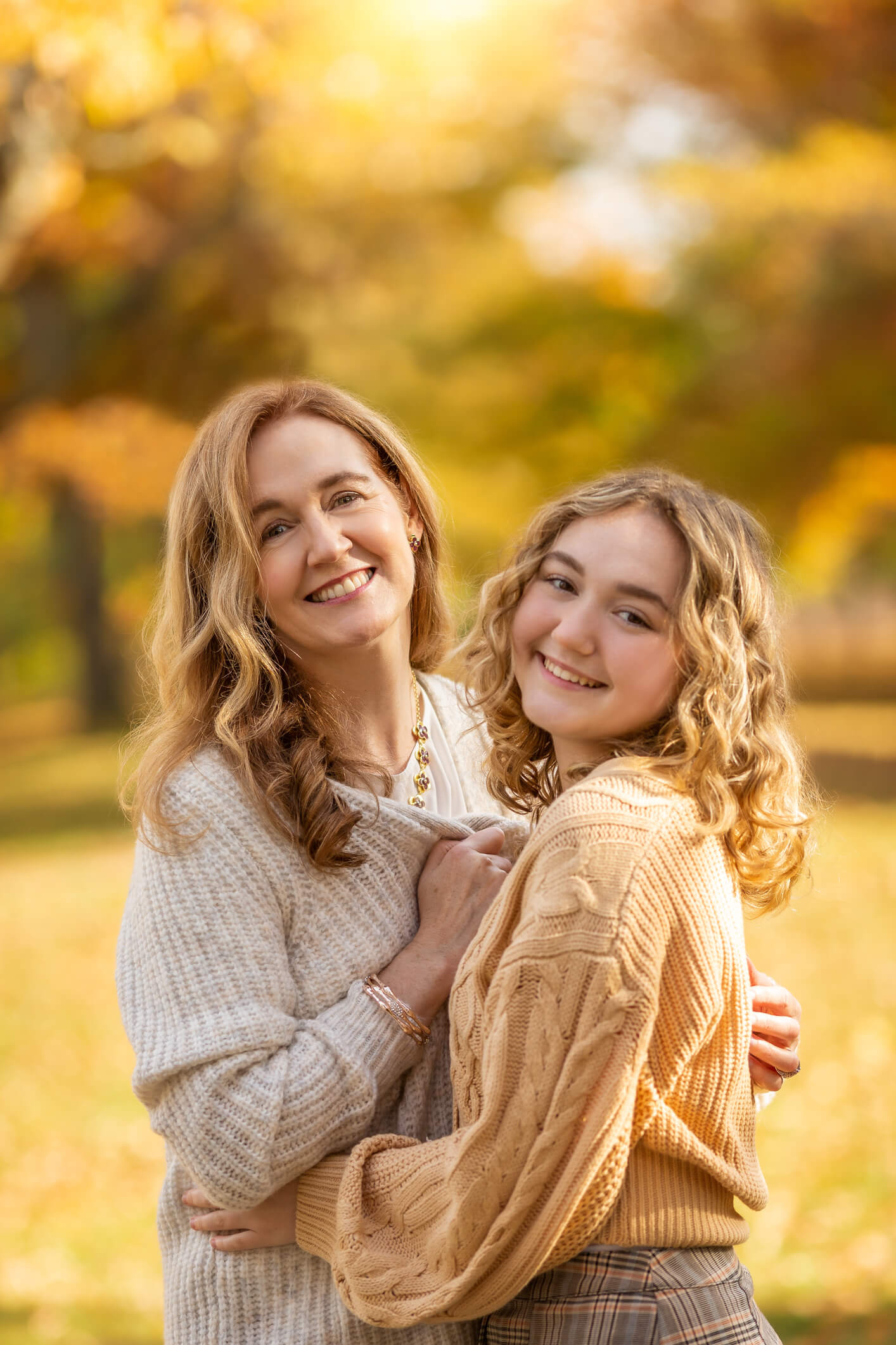 Mom and daughter hugging in Fall, at Lexington, Massachusetts