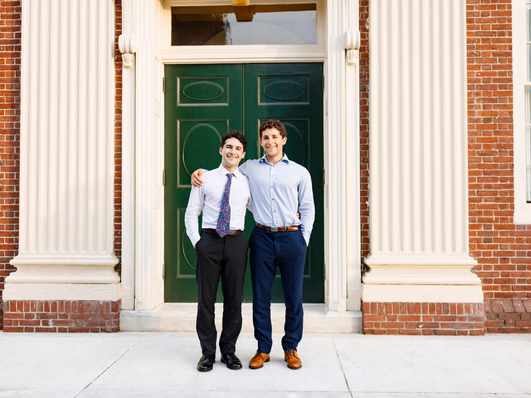 Graaduation man with brother in front of Harvard door, at Boston, Massachusetts