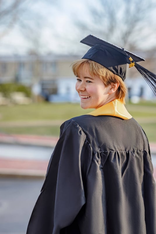 High School Senior wearing black cap and gown