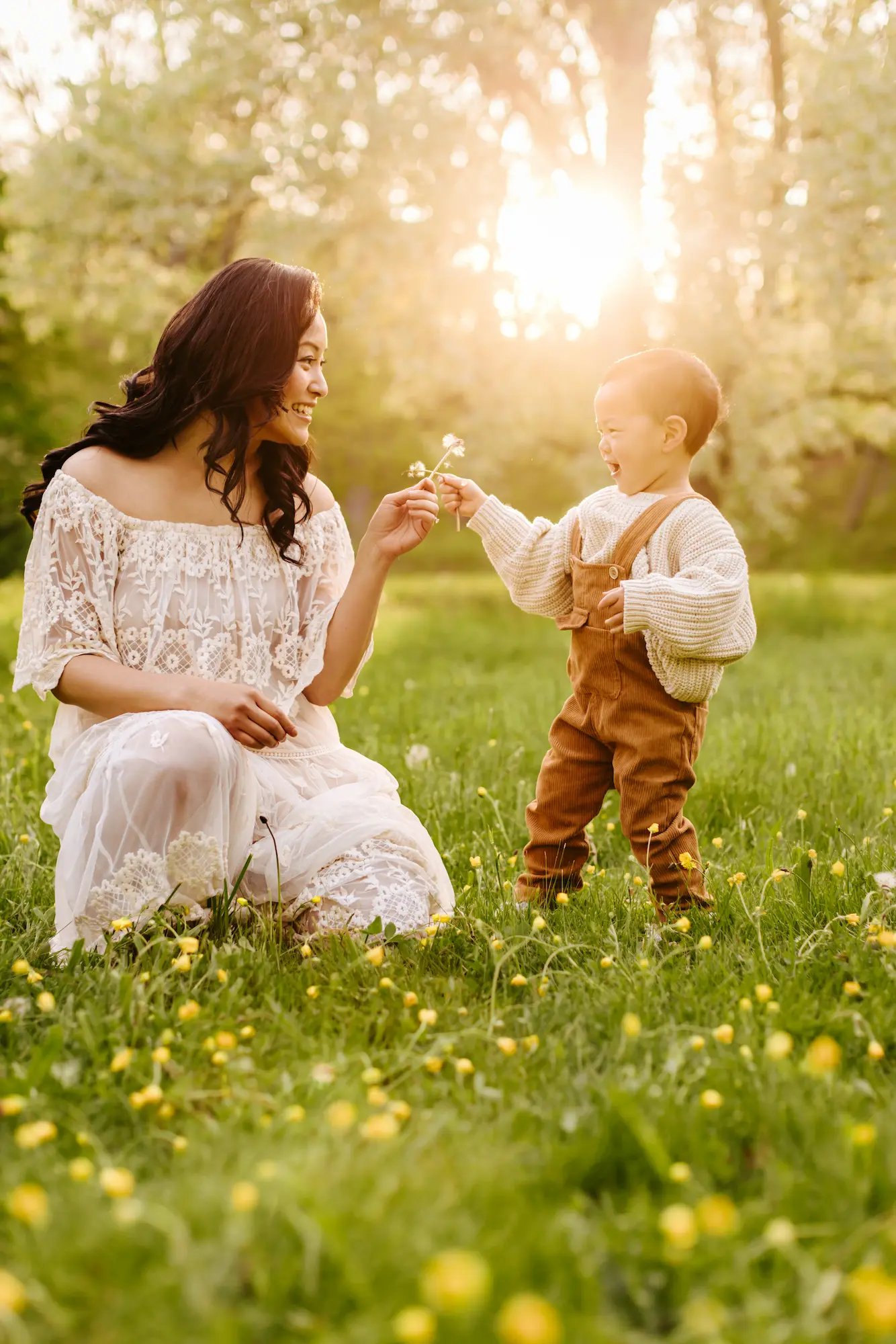 mothers-day-baby-holding-dandelion