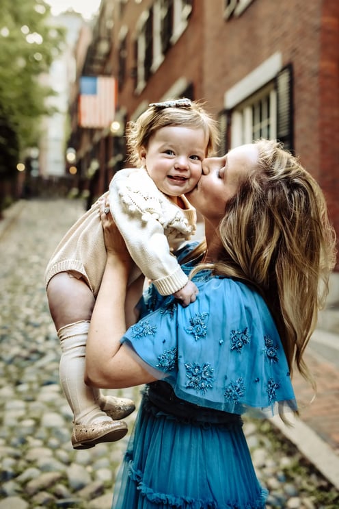 mothers-day-kissing-baby-cheek in Acorn Street in Boston