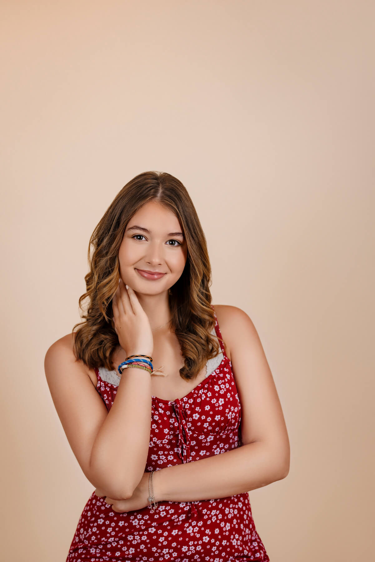 High school senior girl with crossed arms, at Photography Studio in Lexington.