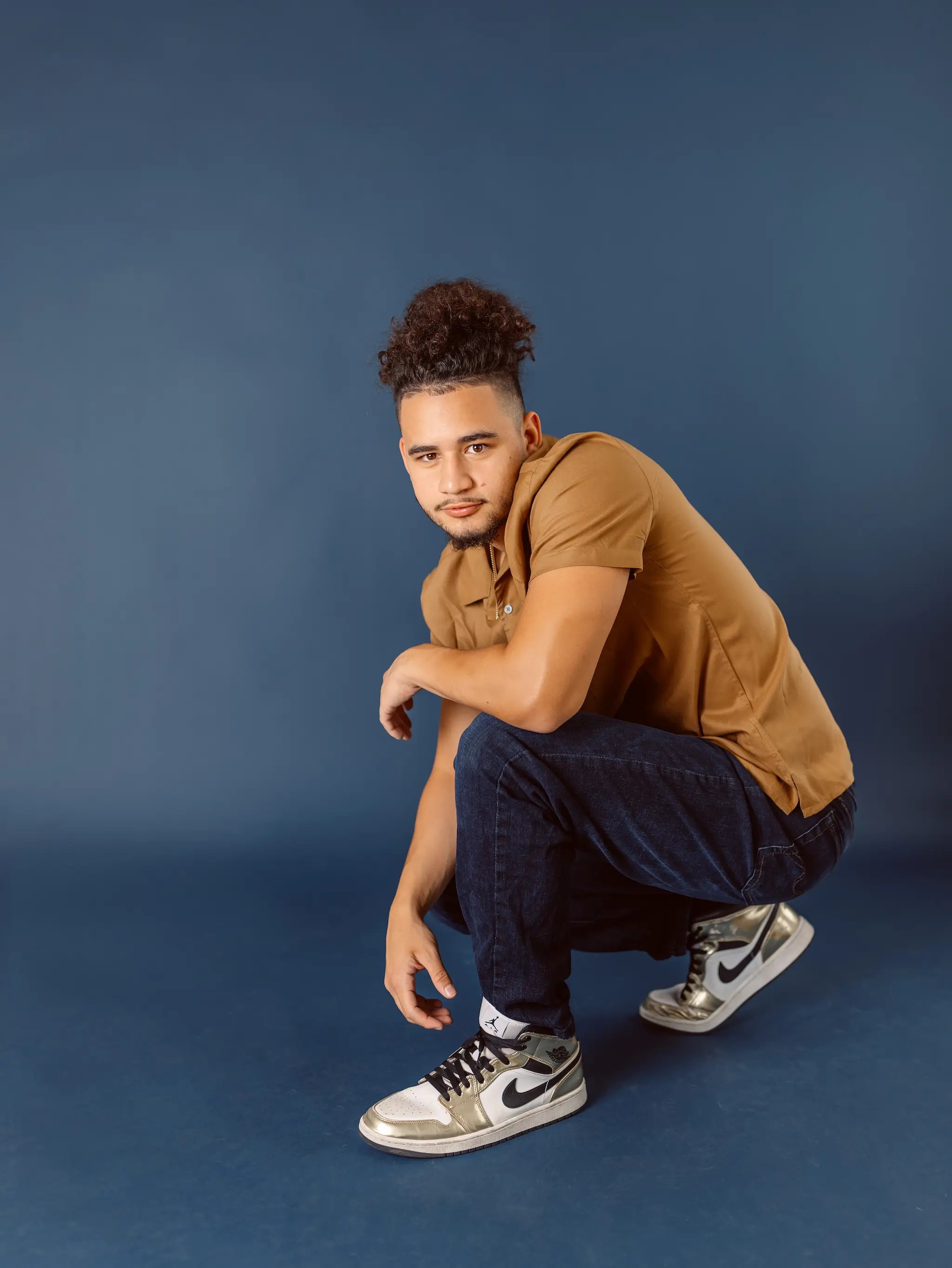 High school senior boy with casual pose, at Photography Studio in Lexington.