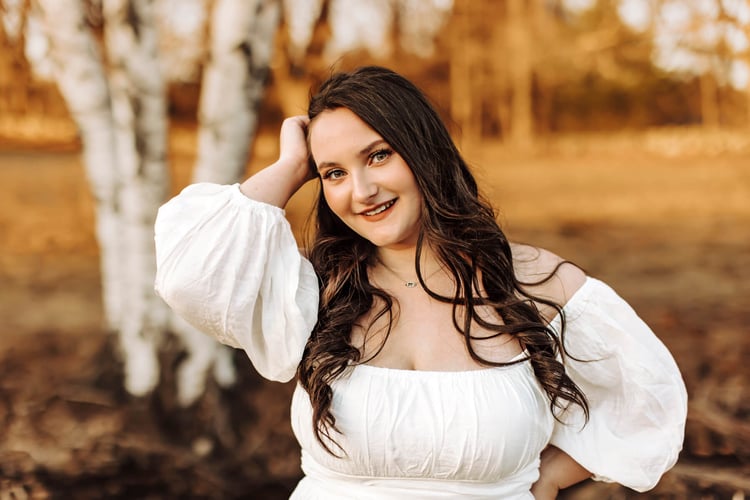 Senior photo in fall at peak foliage in boston