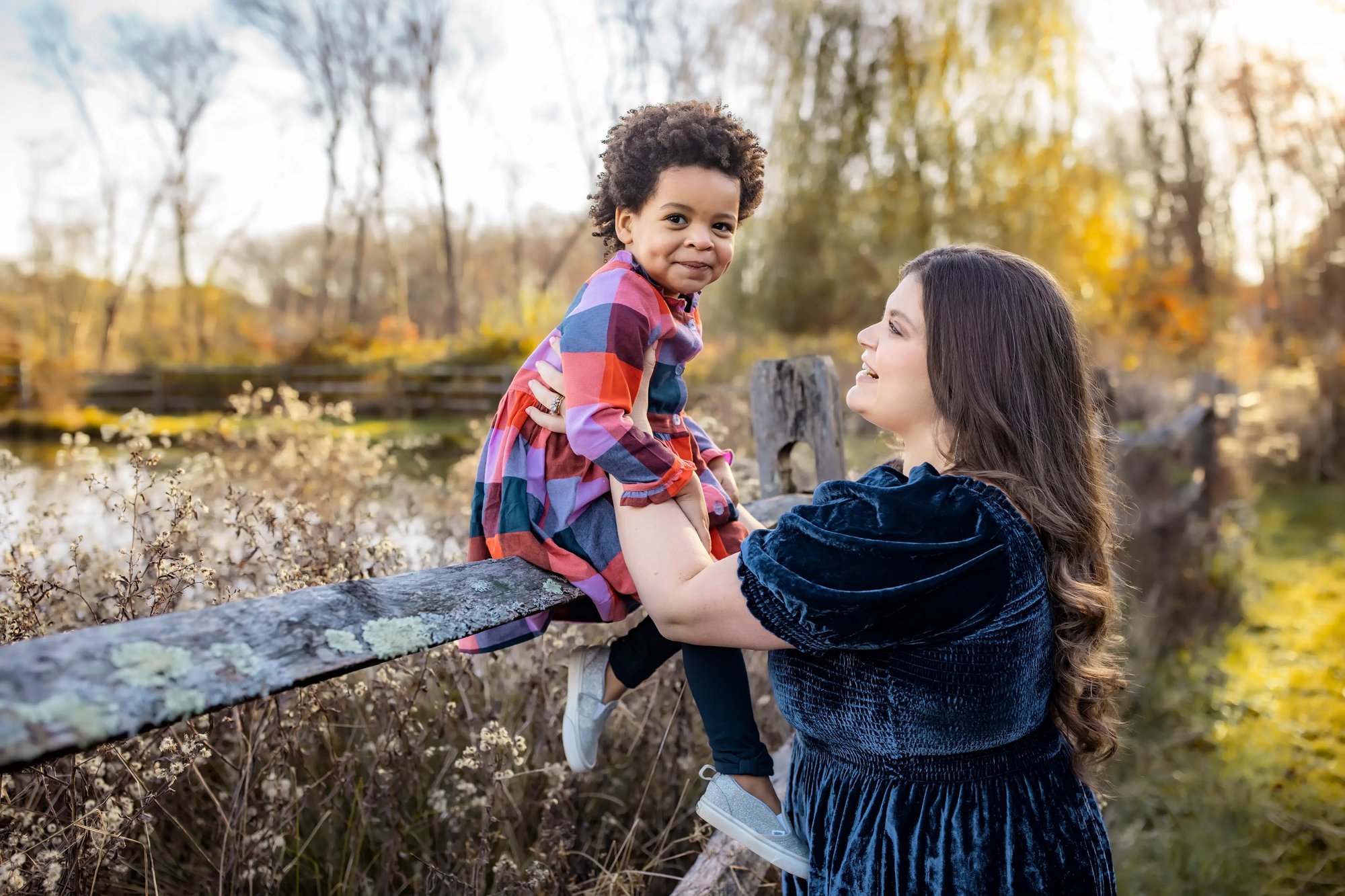 fall_mother and daughter on fence - tree farm photography