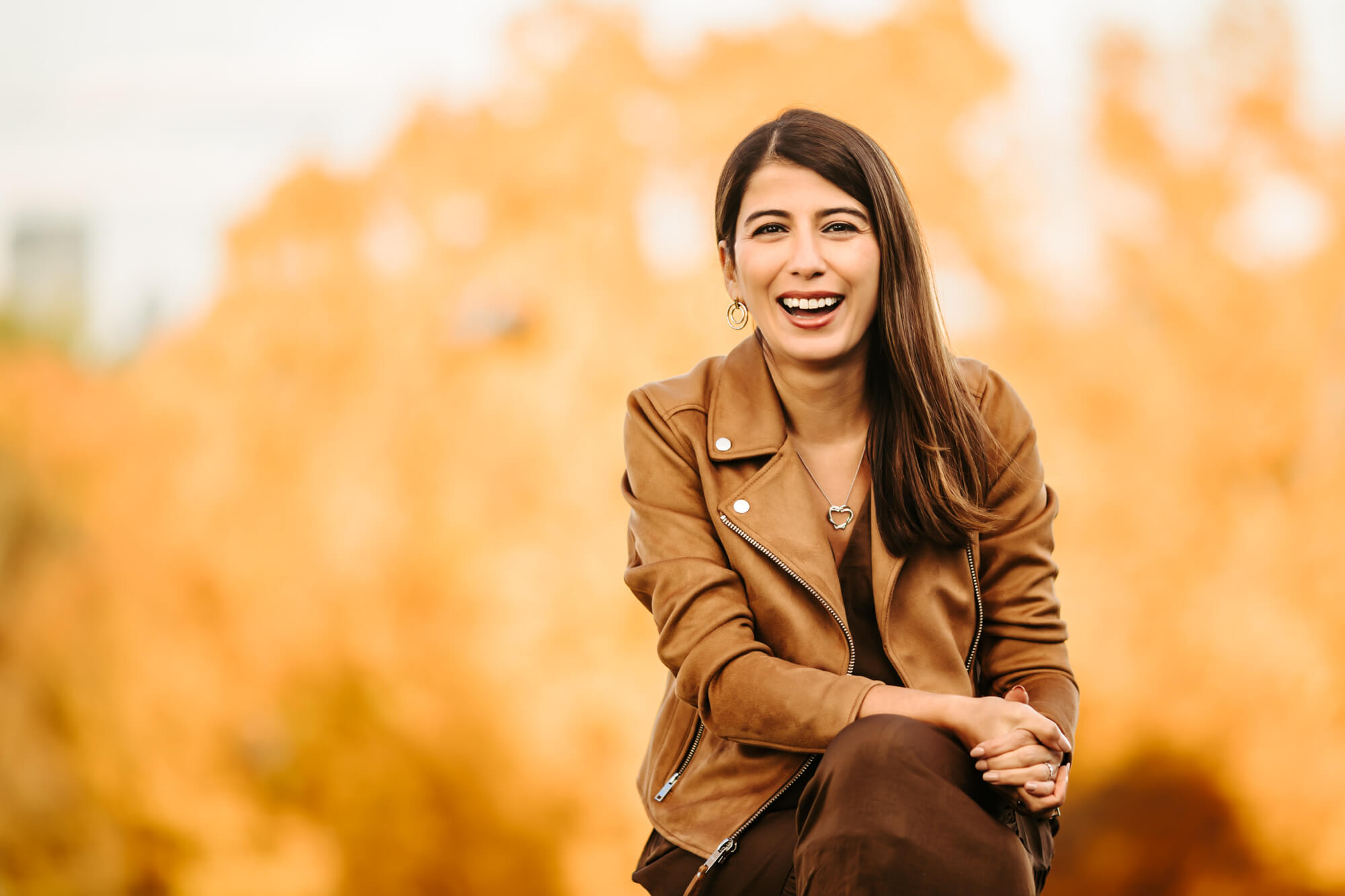 headshot of a woman during peak foliage in Boston