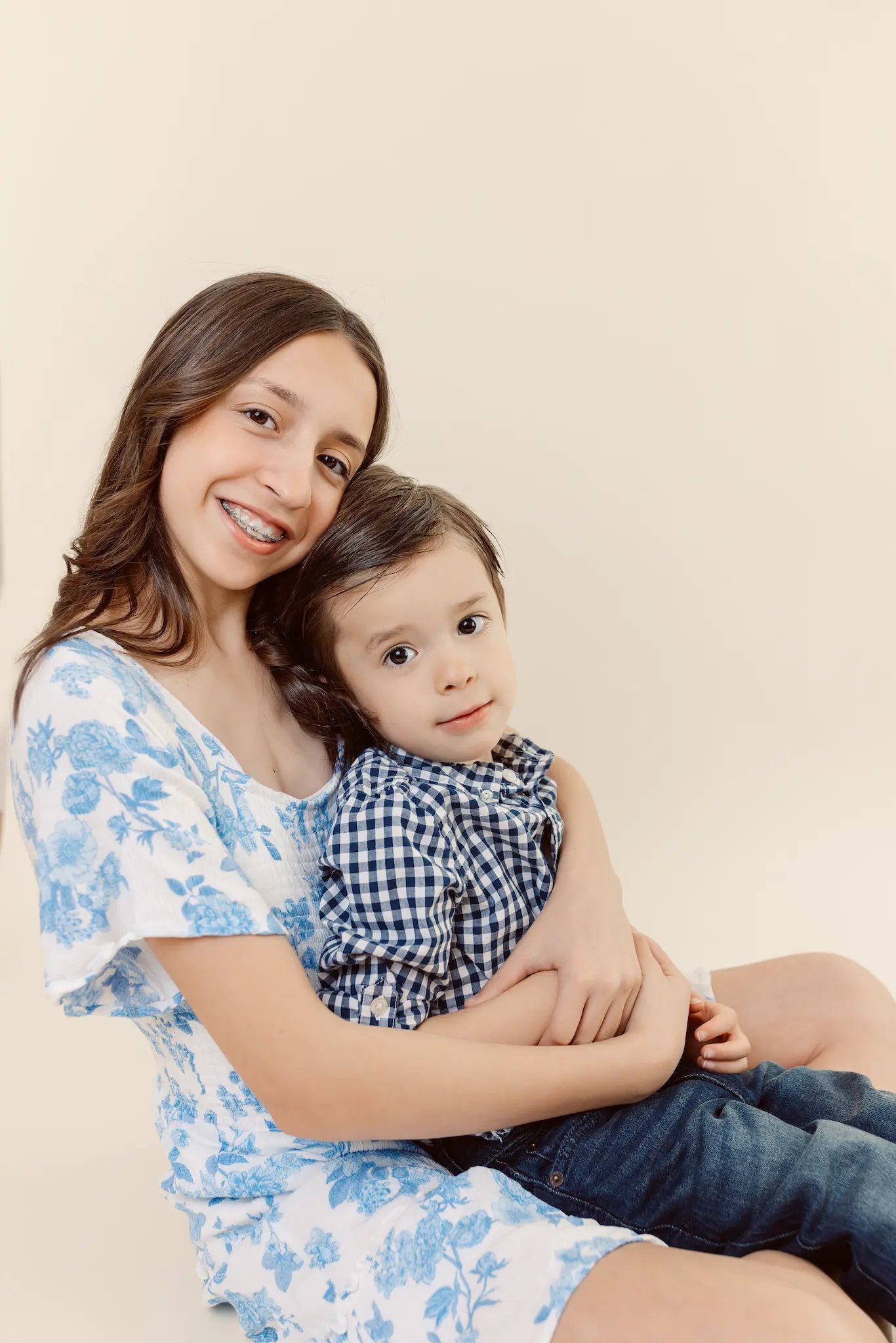a studio photo of mom and her son