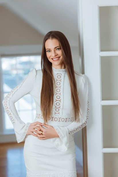 woman headshot, she is posed next to a french door-1