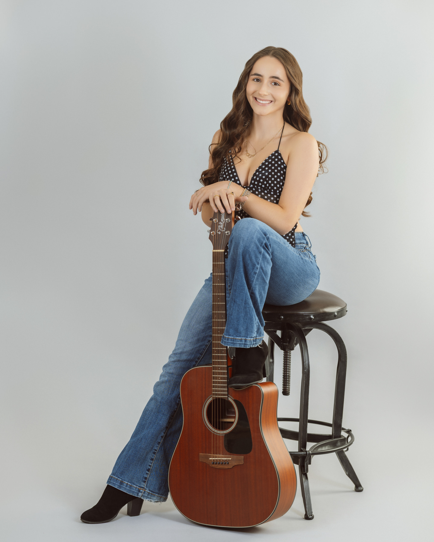 high school senior girl holding a guitar in the studio in Lexington Boston high school senior girl holding a guitar in the studio in Lexington Boston